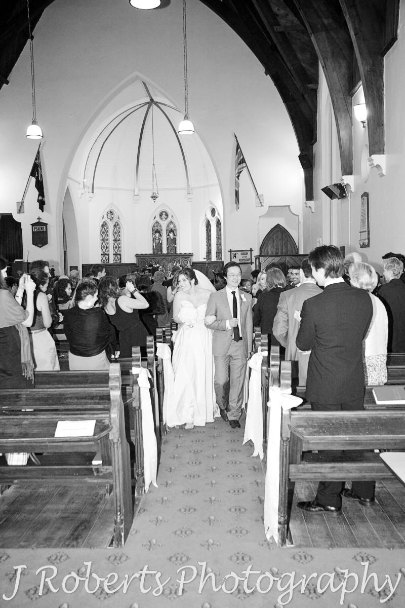 Bride and groom walking down the aisle at Christ Church Lavender Bay - wedding photography sydney
